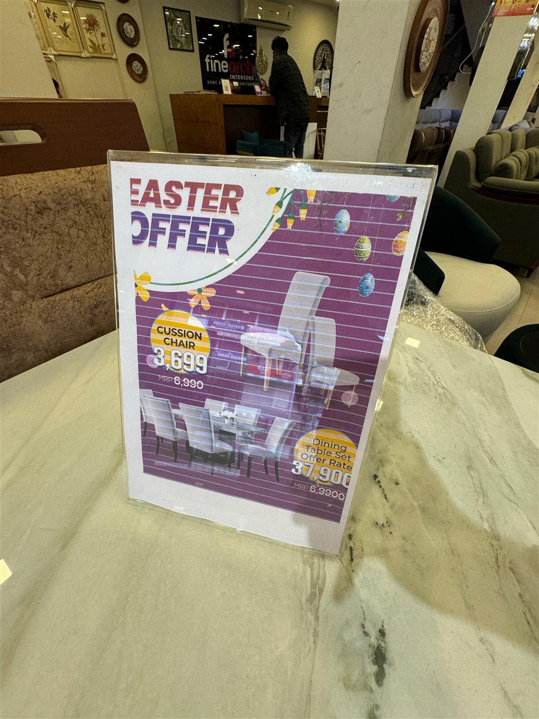 Finearch Interiors Easter offer signage inside the Chirakkal showroom, arch-style branding and seasonal decor